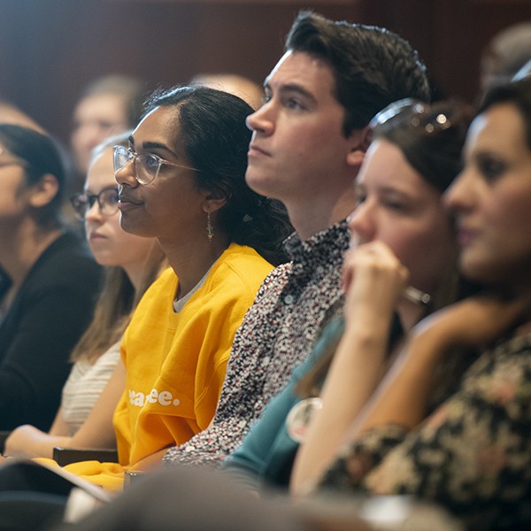 WashULaw students listen to speakers in moot courtroom.