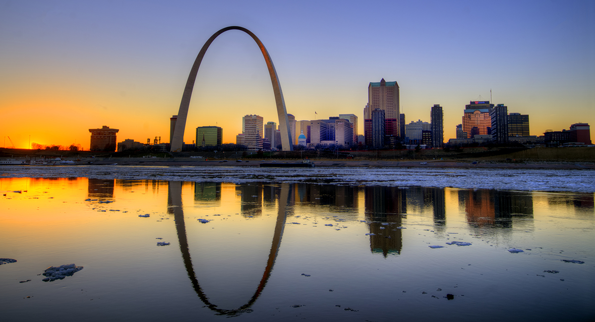 The Arch and downtown St Louis at sunset.